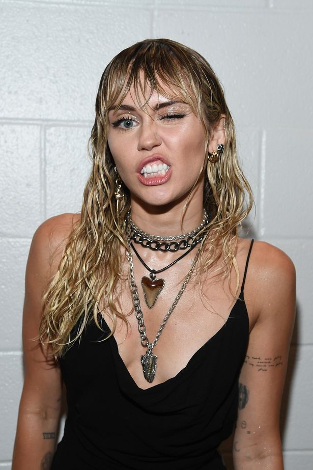 Miley Cyrus unveils new tattoo at VMAs hinting at dark reason for Liam Hemsworth split