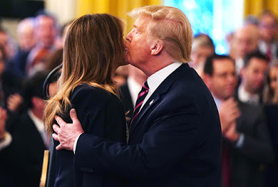 Melania Trump turns cheek as the President tries to kiss her (see the awkward brush-off)