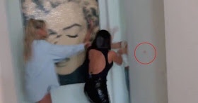 Kourtney Kardashian slapped her sister Kim so hard that her make up transferred to the wall!