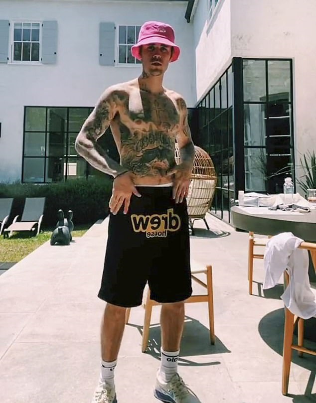 Justin Bieber shows off his extensive tattoo collection