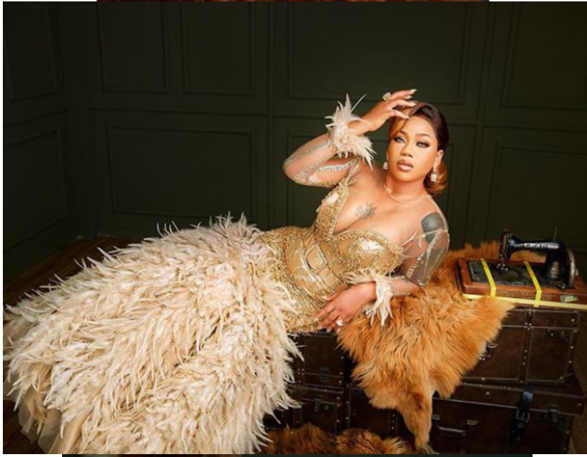 [PHOTOS] Toyin Lawani Stuns In Glittering Gold Dresses For 37th Birthday