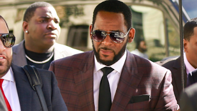 R Kelly charged with two counts of child prostitution